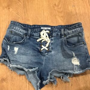 LITE HEARTED LACE-UP CUTOFF DENIM SHORTS